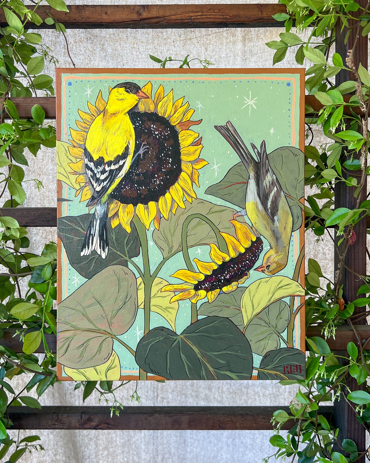 Original painting with two gold finches on sunflowers, surrounded by greenery