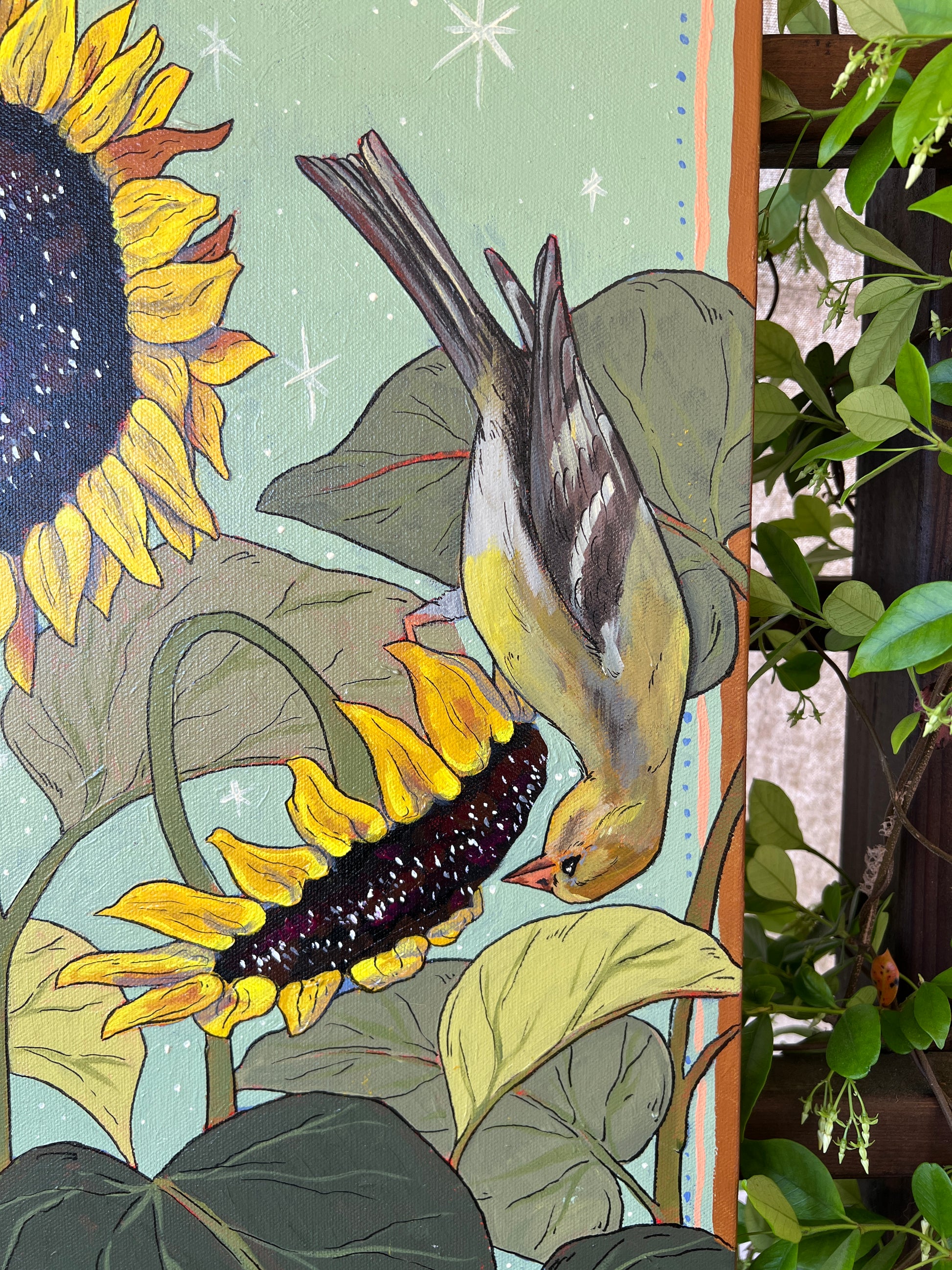 Detail of original painting with female gold finch on sunflowers, surrounded by greenery